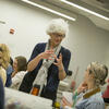 An image of a professor instructing a student in an art therapy class