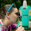 Environmental Science student examining foliage through a microscope